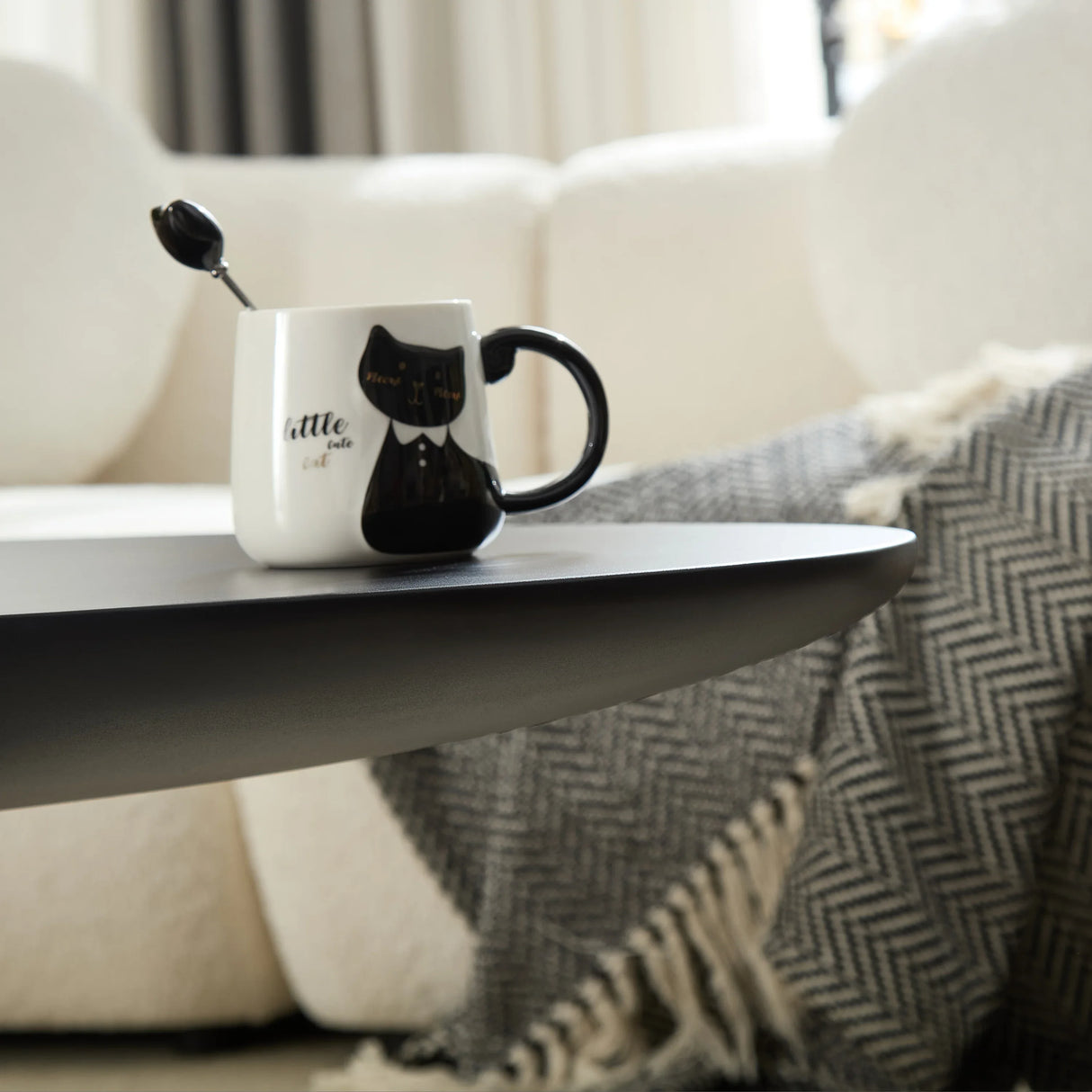 Minimalist Black Fiberglass Lucky Stone Oval Coffee Table - Omega Lifestyles