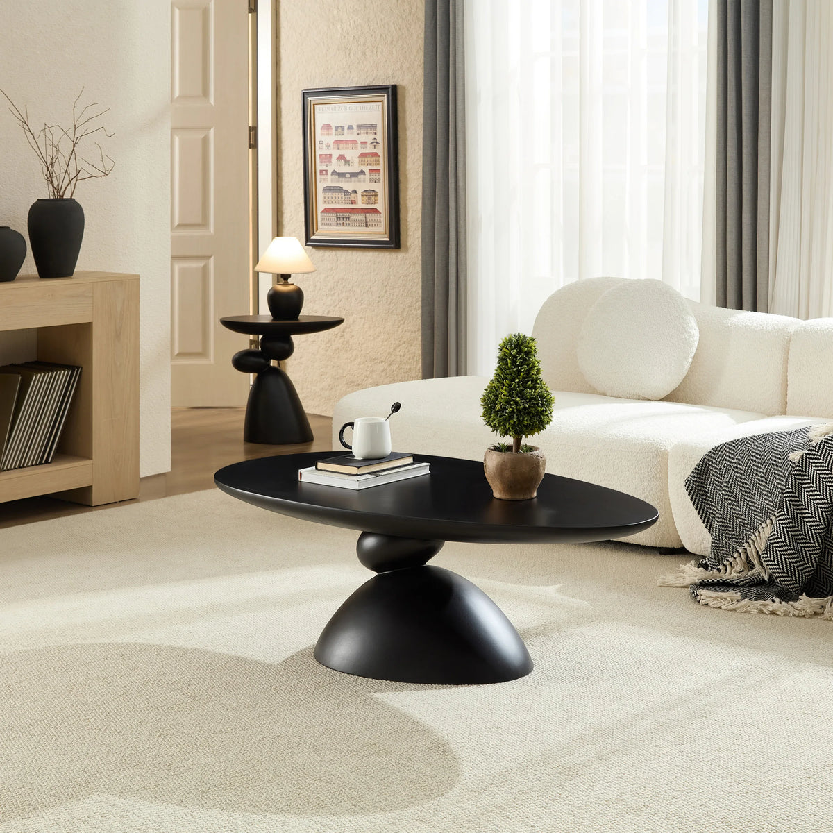 Minimalist Black Fiberglass Lucky Stone Oval Coffee Table - Omega Lifestyles